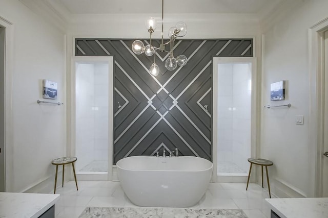 bathroom with an inviting chandelier, marble finish floor, a freestanding tub, and a stall shower