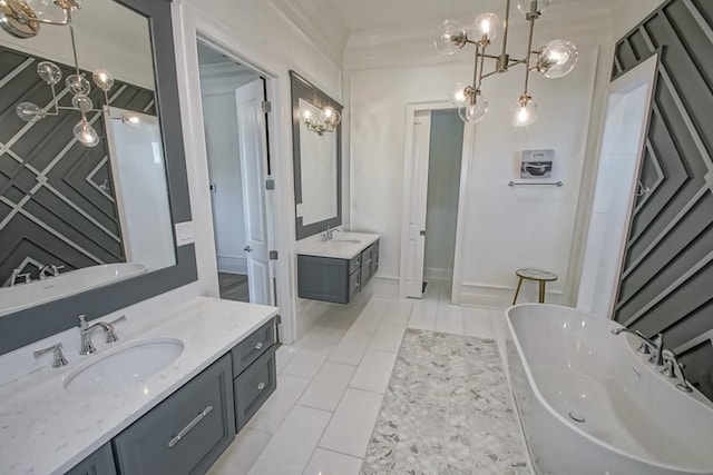 bathroom featuring vanity, tile patterned floors, and a tub