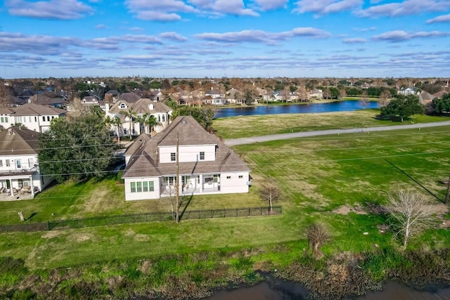 bird's eye view featuring a residential view and a water view