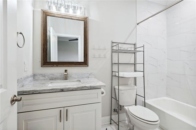 full bathroom featuring vanity, toilet, and tiled shower / bath combo