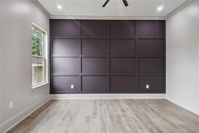 unfurnished room featuring light hardwood / wood-style floors, ornamental molding, and ceiling fan