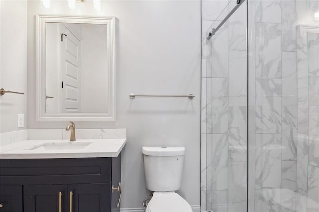 bathroom featuring toilet, vanity, and an enclosed shower