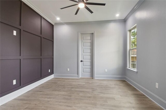 spare room featuring ceiling fan, crown molding, light hardwood / wood-style floors, and a healthy amount of sunlight