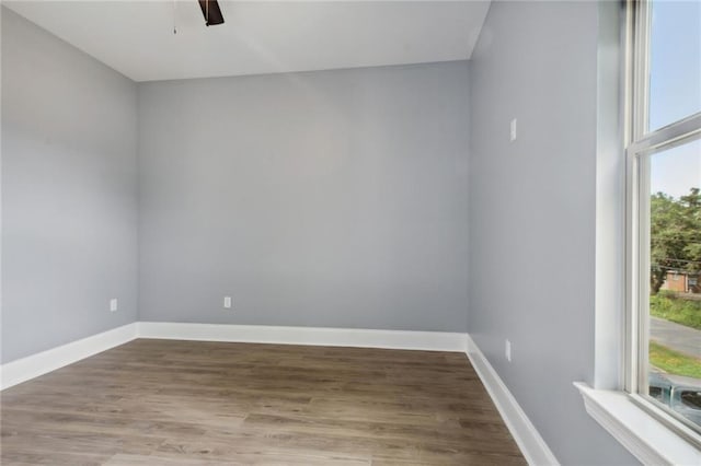 empty room featuring ceiling fan and hardwood / wood-style flooring