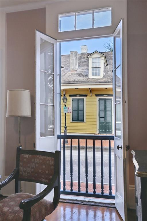 doorway to outside featuring a wealth of natural light and hardwood / wood-style flooring