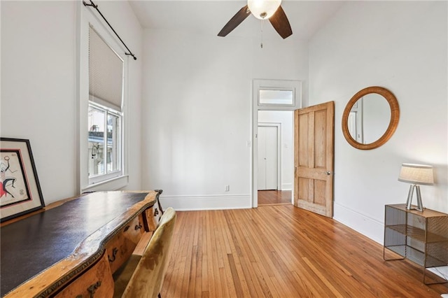 interior space featuring hardwood / wood-style floors and ceiling fan