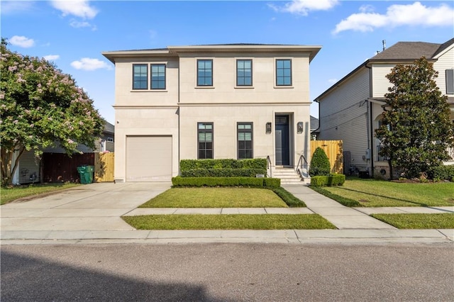 view of front property with a garage and a front lawn