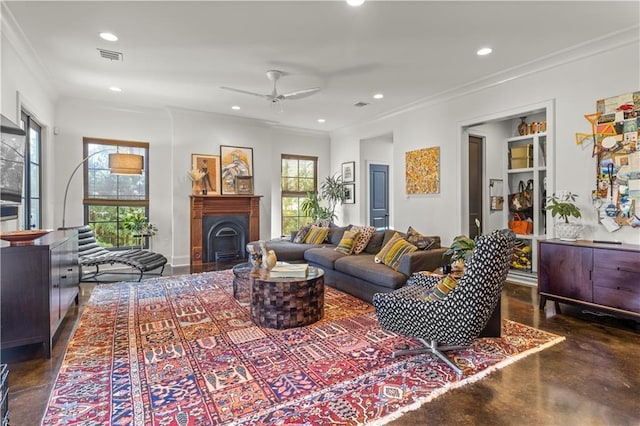 living room with crown molding, ceiling fan, and plenty of natural light