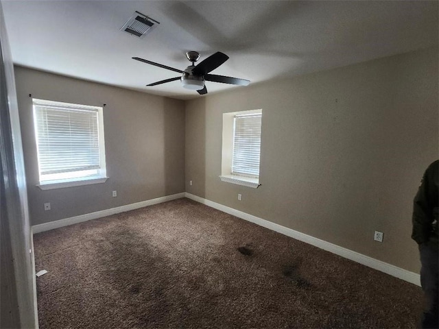 unfurnished room with carpet flooring and ceiling fan