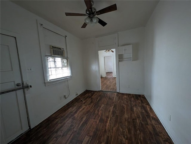 unfurnished bedroom featuring ceiling fan, dark wood-type flooring, and a wall mounted AC