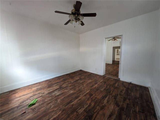 interior space with ceiling fan and dark hardwood / wood-style flooring