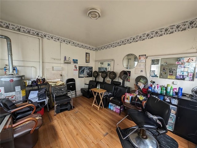 office area featuring water heater and light hardwood / wood-style flooring