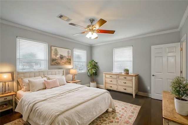 bedroom featuring dark wood-type flooring, ceiling fan, and ornamental molding