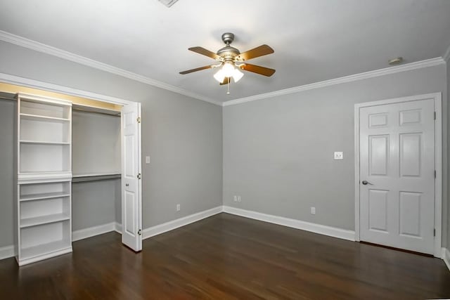 unfurnished bedroom featuring ornamental molding, dark hardwood / wood-style flooring, ceiling fan, and a closet