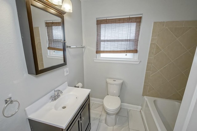 bathroom featuring vanity, toilet, and tile patterned flooring