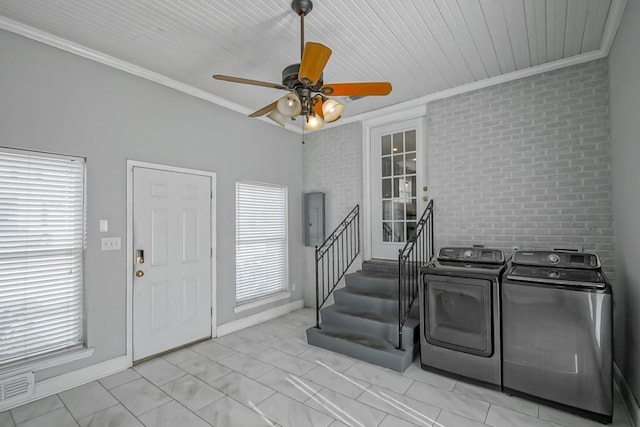 washroom featuring ornamental molding, separate washer and dryer, electric panel, and ceiling fan