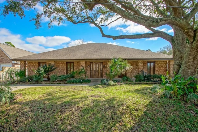 ranch-style house with a front yard