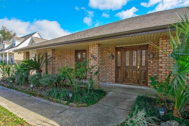 property entrance featuring a porch