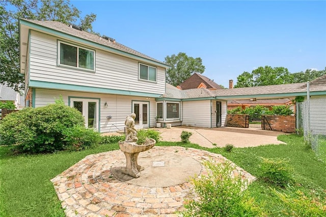 rear view of property featuring a patio area and french doors