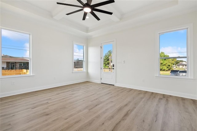 unfurnished room with beamed ceiling, light hardwood / wood-style floors, plenty of natural light, and coffered ceiling