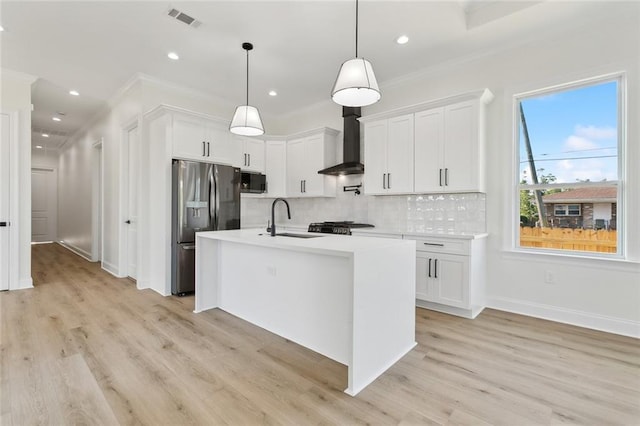 3124 Utah St, Kenner, LA 70065 - kitchen featuring wall chimney exhaust hood, stainless steel refrigerator with ice dispenser, ornamental molding, tasteful backsplash, and light countertops