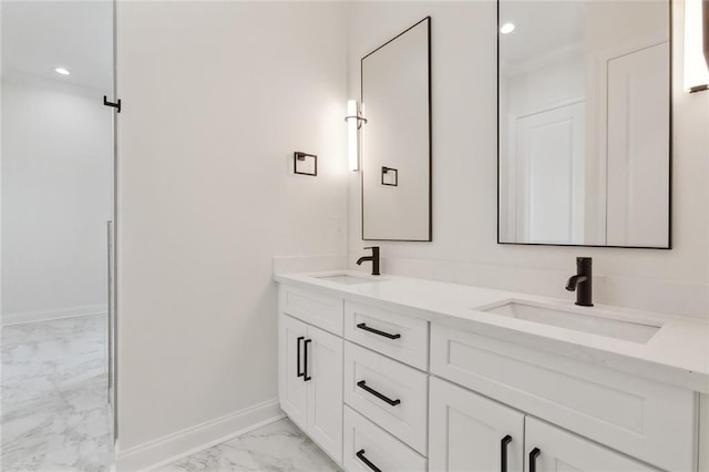 3124 Utah St, Kenner, LA 70065 - bathroom featuring marble look tile flooring, double vanity, and recessed lighting