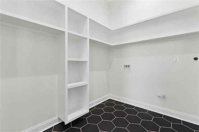 clothes washing area with washer hookup, electric dryer hookup, hookup for a gas dryer, and tile patterned floors