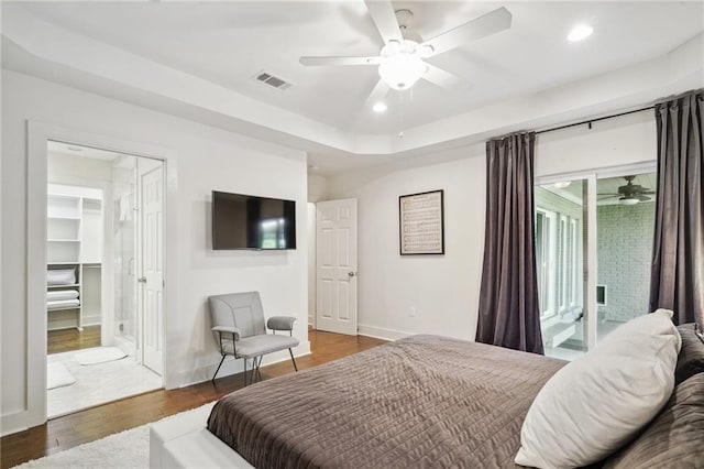 bedroom featuring access to exterior, a walk in closet, ceiling fan, dark hardwood / wood-style floors, and a closet