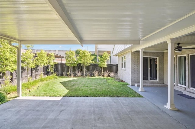 exterior space featuring ceiling fan