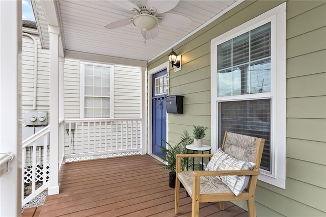 deck with ceiling fan and a porch