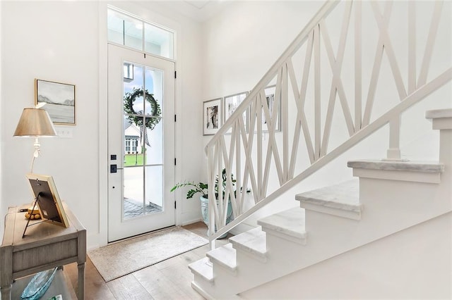 entryway with hardwood / wood-style floors