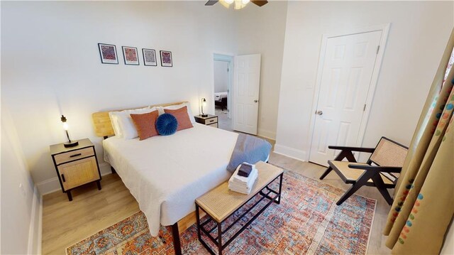 bedroom featuring ceiling fan and light hardwood / wood-style flooring