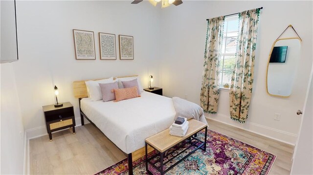 bedroom featuring ceiling fan and light wood-type flooring