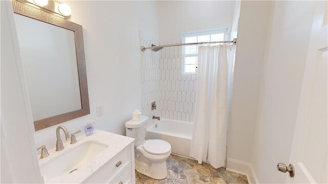 full bathroom with vanity, toilet, and shower / tub combo with curtain