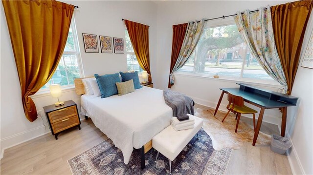 bedroom with light hardwood / wood-style flooring