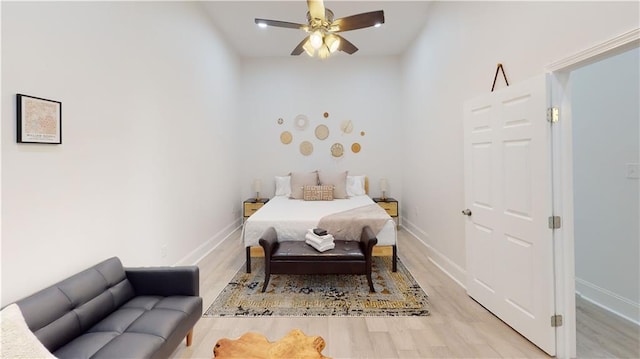 bedroom featuring ceiling fan and light hardwood / wood-style flooring