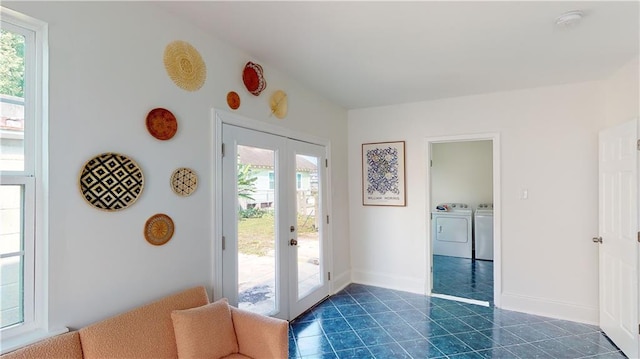 doorway to outside featuring french doors and washer and clothes dryer