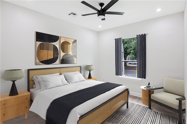 bedroom featuring ceiling fan and hardwood / wood-style floors