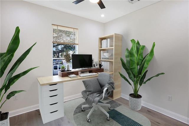 office space with ceiling fan and hardwood / wood-style flooring