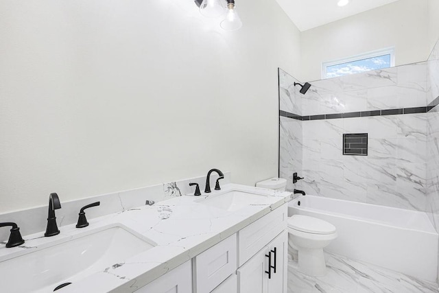 full bathroom featuring toilet, vanity, and tiled shower / bath