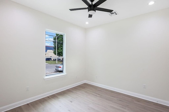 unfurnished room with ceiling fan and wood-type flooring