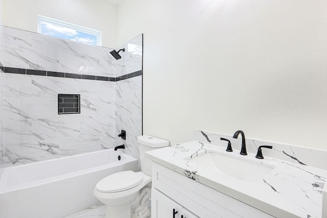 full bathroom featuring toilet, vanity, and tiled shower / bath combo