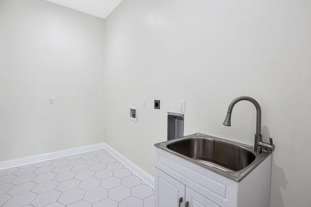 washroom featuring hookup for an electric dryer, light tile patterned floors, hookup for a washing machine, cabinets, and sink