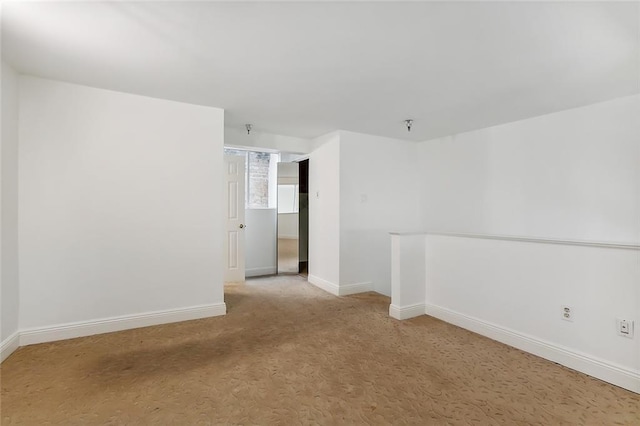 empty room with light colored carpet