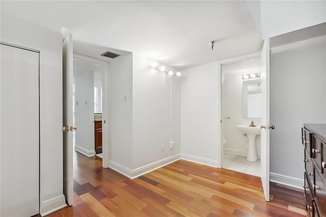 bathroom featuring hardwood / wood-style flooring and sink