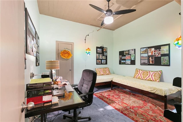 carpeted office with ceiling fan