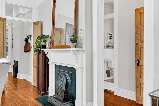 interior space with hardwood / wood-style floors and ornamental molding