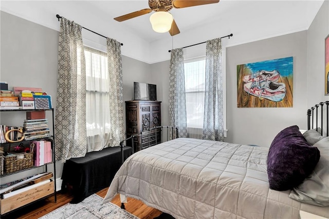 bedroom featuring ceiling fan and wood-type flooring