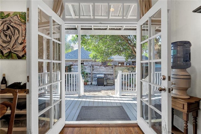 doorway to outside with wood-type flooring and french doors