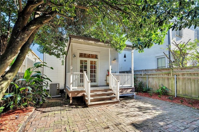 rear view of property with central air condition unit